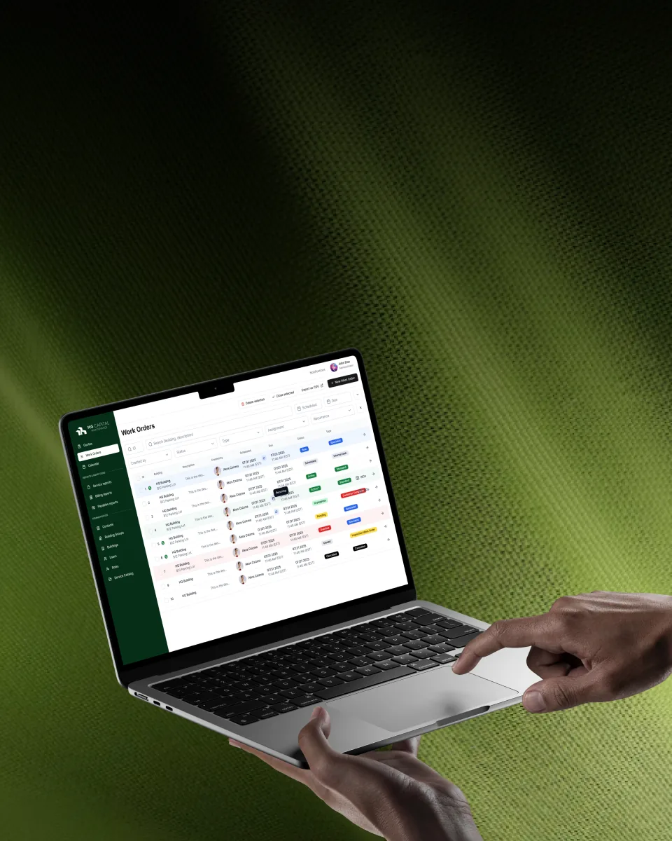 Laptop showing a work orders web app with status tags in a green themed dashboard